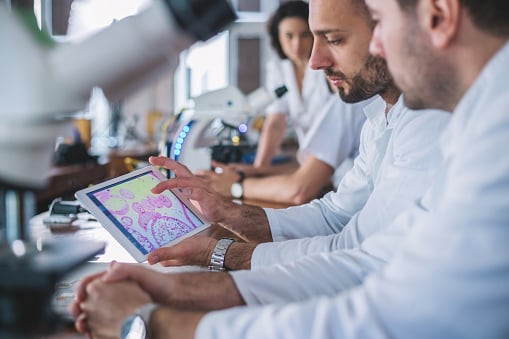 127. Group of doctors analyzing medical data in the laboratory